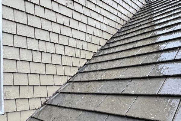 The same roof after soft washing, with the moss removed and tiles clean
